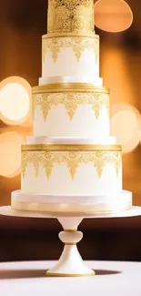 Elegant multi-tiered cake with gold details in soft bokeh background.