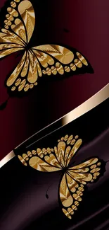 Elegant gold butterflies on burgundy background wallpaper.