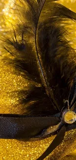 Golden feather with black ribbon on sparkling background.