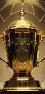 Golden trophy with ornate design on a decorative background.