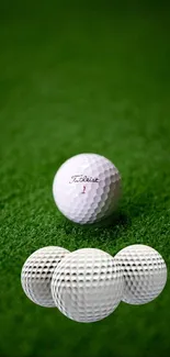 Golf balls on green grass wallpaper for mobile.