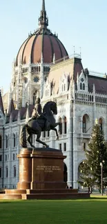 Gothic architecture with statue and blue sky background.