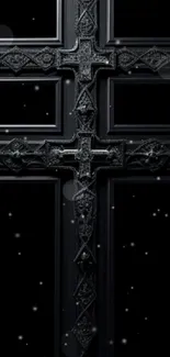 Elegant gothic cross with intricate design on a dark background.