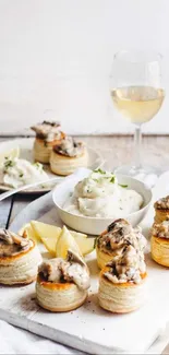 Elegant gourmet dining setup with white wine and vol-au-vents.