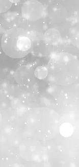 Elegant gray bokeh wallpaper with soft circles creating a serene background.