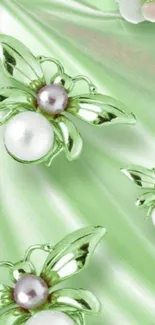 Elegant green butterfly wallpaper with pearls and flowers.