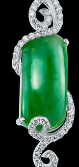 Green gemstone with elegant silver detail on black background.