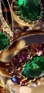 Green gemstone rings with gold detailing.