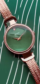 Elegant watch with green face on stylish background.