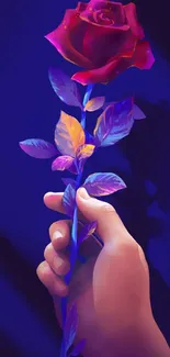 Artistic hand holding a vibrant red rose with colorful leaves, deep blue background.