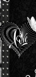 A black heart design with a white butterfly on a textured background.