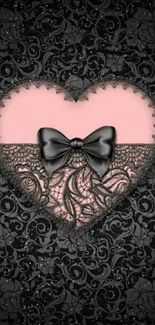 Elegant black lace heart with a pink background and black bow wallpaper.