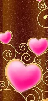 Pink hearts and golden swirls on a brown background wallpaper.