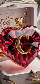 Heart-shaped red gemstone pendant with gold chain in a jewelry box.