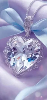 Heart-shaped crystal pendant on lavender fabric with a blue ribbon.