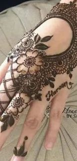 Intricate henna design on hand, perfect smartphone wallpaper.