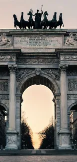 Majestic historical archway at sunset under warm hues.