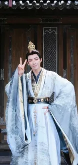 Elegant figure in historical Chinese costume against wooden backdrop.