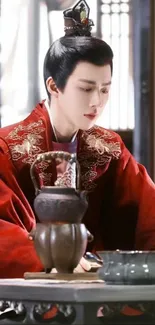 Elegant historical figure in red robe sitting peacefully.