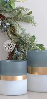 Elegant holiday decor with vases and greenery arrangement.