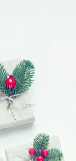 Minimalist holiday wallpaper with gifts, pine, and red berries on a white background.