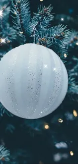 White ornament on Christmas tree with sparkling lights.