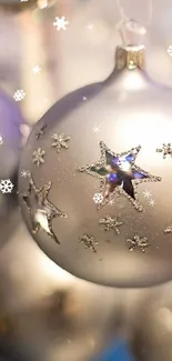 Silver ornaments with star details and bokeh effect in a festive holiday theme.