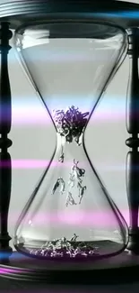 Elegant hourglass with pink and blue lights, perfect phone wallpaper.