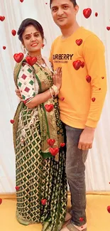 Elegant Indian couple in traditional attire with a golden background.