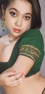 Elegant woman in traditional Indian attire with green blouse.