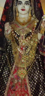 Elegant Indian deity adorned in regal garments and intricate jewelry.