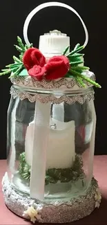 Jar candle with red flowers and green foliage, perfect for wallpaper.