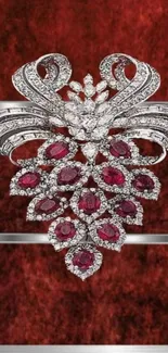 Intricate jewel design with diamonds and rubies on a dark red background.