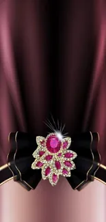 Elegant mobile wallpaper with burgundy satin ribbon and jewels.