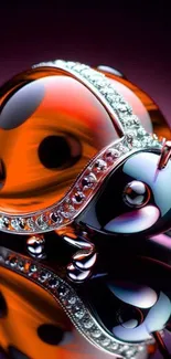 Jeweled ladybug artwork with shiny gems on reflective surface.