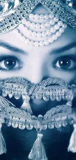 Veiled face with intricate jewel decoration in cool blue tones.