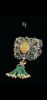 Luxurious jeweled bracelet with green, gold, and silver details on a black background.