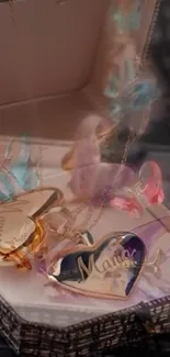 A jewelry box filled with colorful, heart-shaped charms.