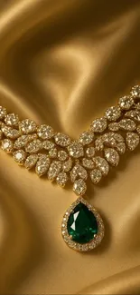 Emerald and diamond necklace on gold silk.