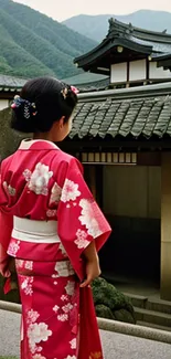 Girl in red kimono standing by traditional Japanese temple.