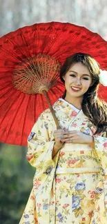 Woman in floral kimono with red umbrella.