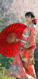 Woman in kimono with red umbrella and cherry blossoms.