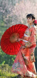 Woman in red kimono with parasol in natural setting.