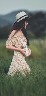 Woman in floral dress walking through lush green meadow.