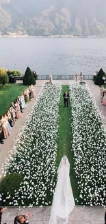 Elegant wedding aisle with scenic lakeside view and mountain backdrop.