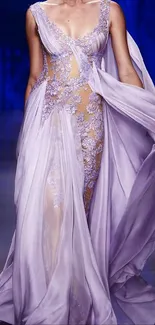 Elegant person in a lavender evening gown with intricate lace details.