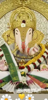 Lord Ganesha with gold details and floral garland.