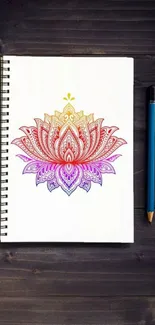 Vibrant lotus sketch on a notepad with a pencil, perfect for mobile wallpaper.