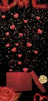 Red hearts and gift box with golden sparkles on a black background.