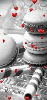 Elegant macarons on a crystal platter with decorative pearls.